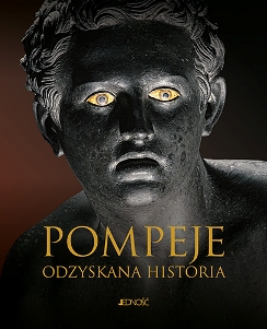 Okładka przedstawiająca rzeźbę związaną z Pompejami; dominują ciepłe odcienie ziemi i motywy archeologiczne.